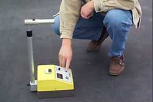 Nuclear moisture gauge used for non-destructive roof moisture surveys